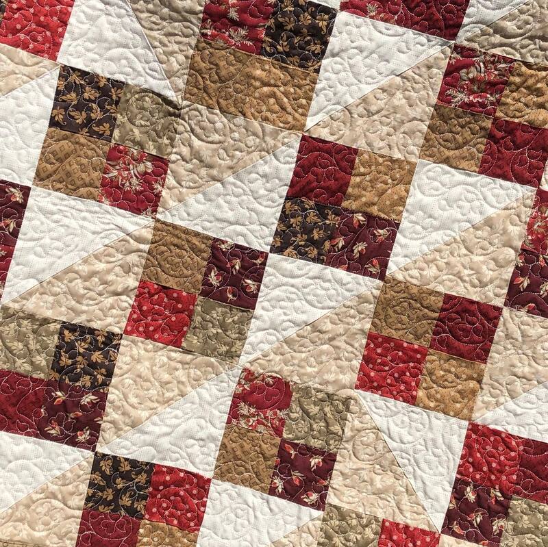 Fall colors are perfect for this quilt, machine quilted by Amy Martin of Peaceful Quilts located in Lafayette Indiana. 