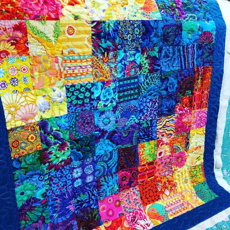 Kaffe Fassett fabrics are the highlight of this beautiful patchwork quilt, machine quilted by Amy Martin of Peaceful Quilts located in Lafayette Indiana. 
