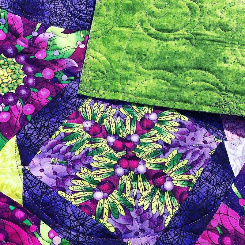 Bright quilt, machine quilted by Amy Martin of Peaceful Quilts in Lafayette Indiana