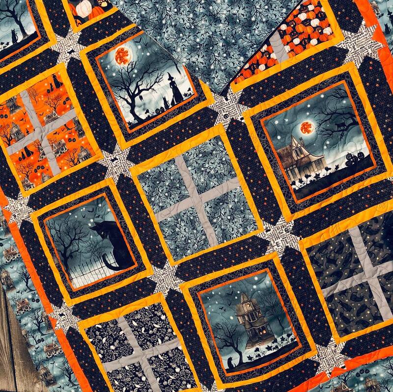 A beautiful halloween quilt, machine quilted by Amy Martin of Peaceful Quilts located in Lafayette Indiana. 