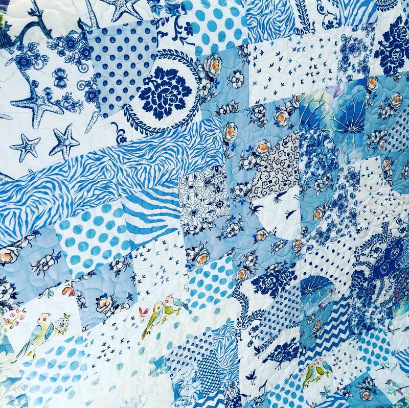 A classic blue and white quilt, machine quilted by Amy Martin of Peaceful Quilts in Lafayette Indiana