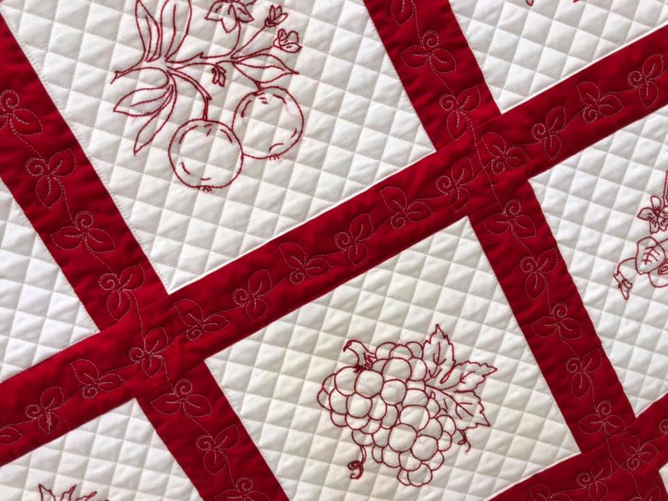 Amy Martin of Peaceful Quilts in Lafayette Indiana took vintage Redwork embroidery from the 1930's and made beautiful wall quilts to display