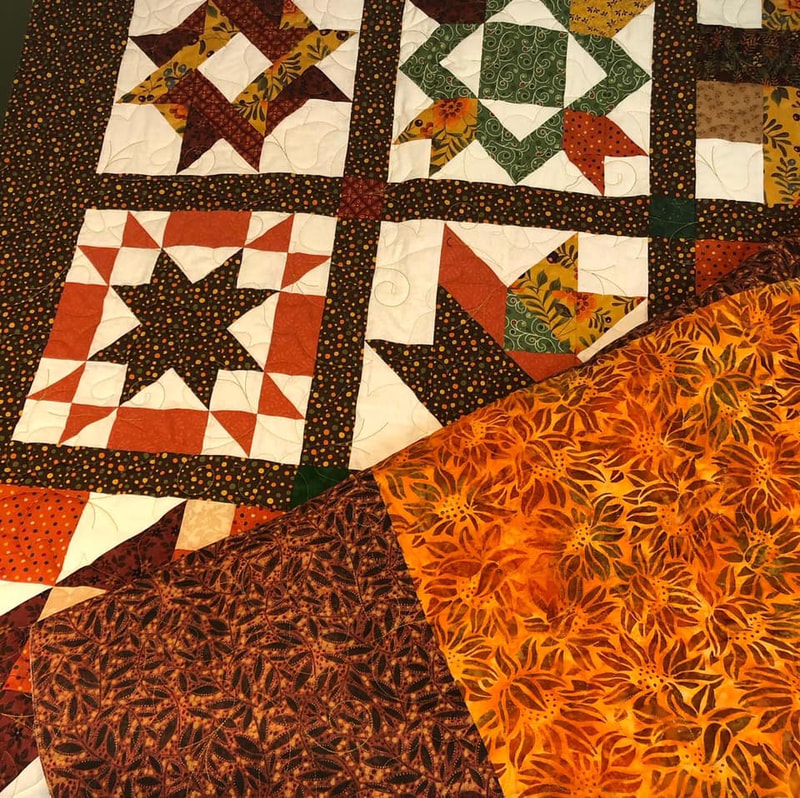 A fall quilt longarmed by Amy Martin of Peaceful Quilts in Lafayette Indiana