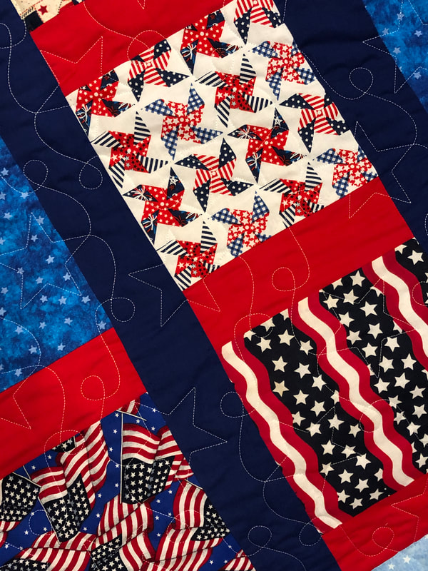 Stars and Stripes on a patriotic quilt, machine quilted by Amy Martin of Peaceful Quilts in Lafayette Indiana