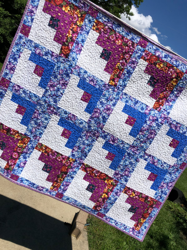 Log Cabin Quilt in purple and white, machine quilted by Amy Martin of Peaceful Quilts